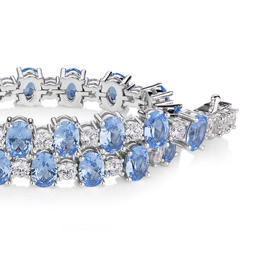 Oval and Round Brilliant tennis bracelet with blue topaz simulants and 3.26 carats* of diamond simulants in sterling silver secondary view