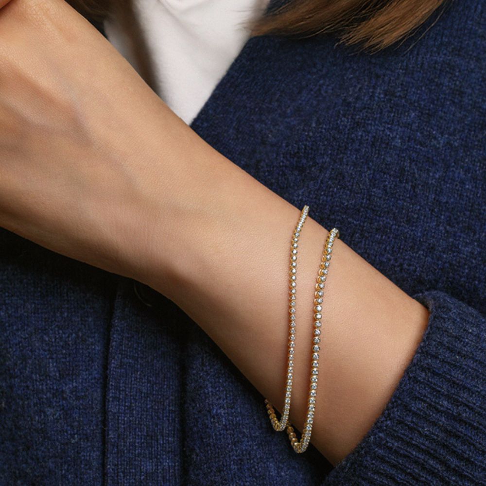 Premium Lab-Grown Diamond, 0.70 carat TW round brilliant tennis bracelet in 10 carat yellow gold