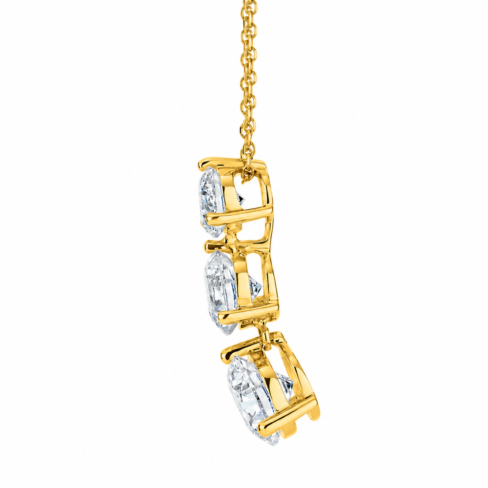 Three stone drop pendant with 2.33 carats* of diamond simulants in 10 carat yellow gold