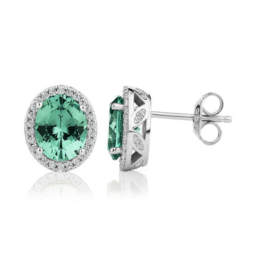 Oval and Round Brilliant halo stud earrings with ocean green simulants and 0.34 carats* of diamond simulants secondary view