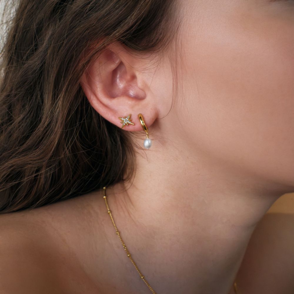 Fancy earrings with round brilliant diamond simulants in 18 carat yellow gold vermeil