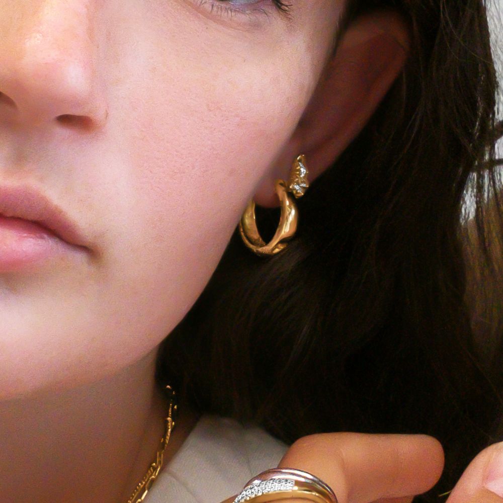 Fancy earrings with diamond simulants in 18 carat yellow gold vermeil