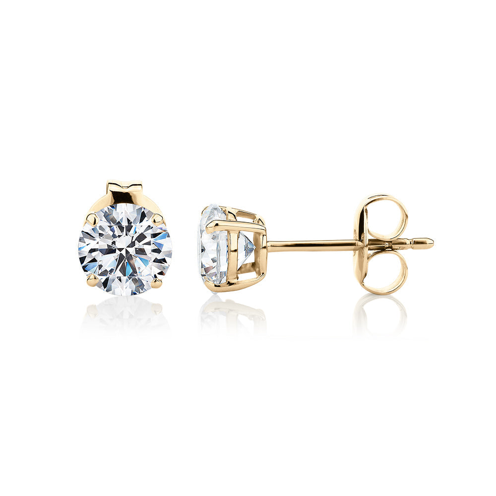 Round Brilliant stud earrings with 1.5 carats* of diamond simulants in 10 carat yellow gold
