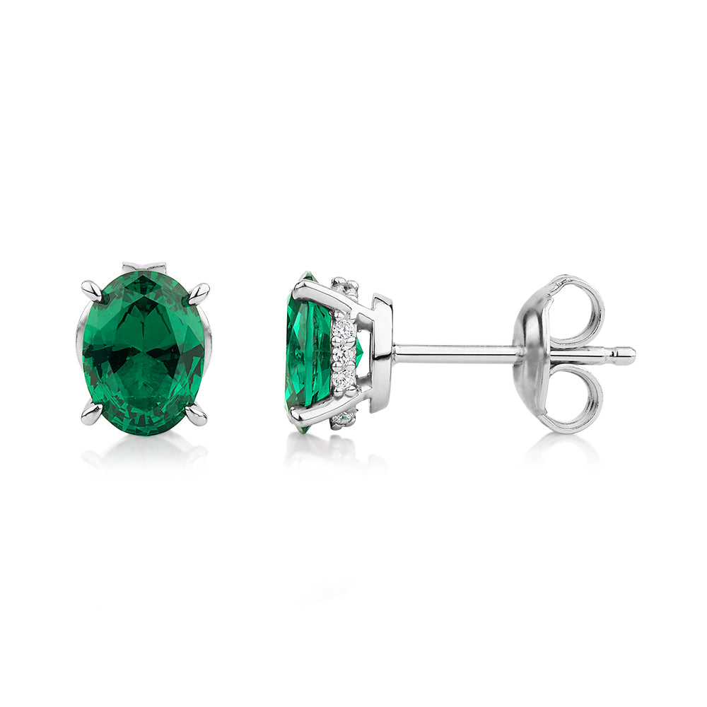 Oval and Round Brilliant stud earrings with emerald and diamond simulants in sterling silver