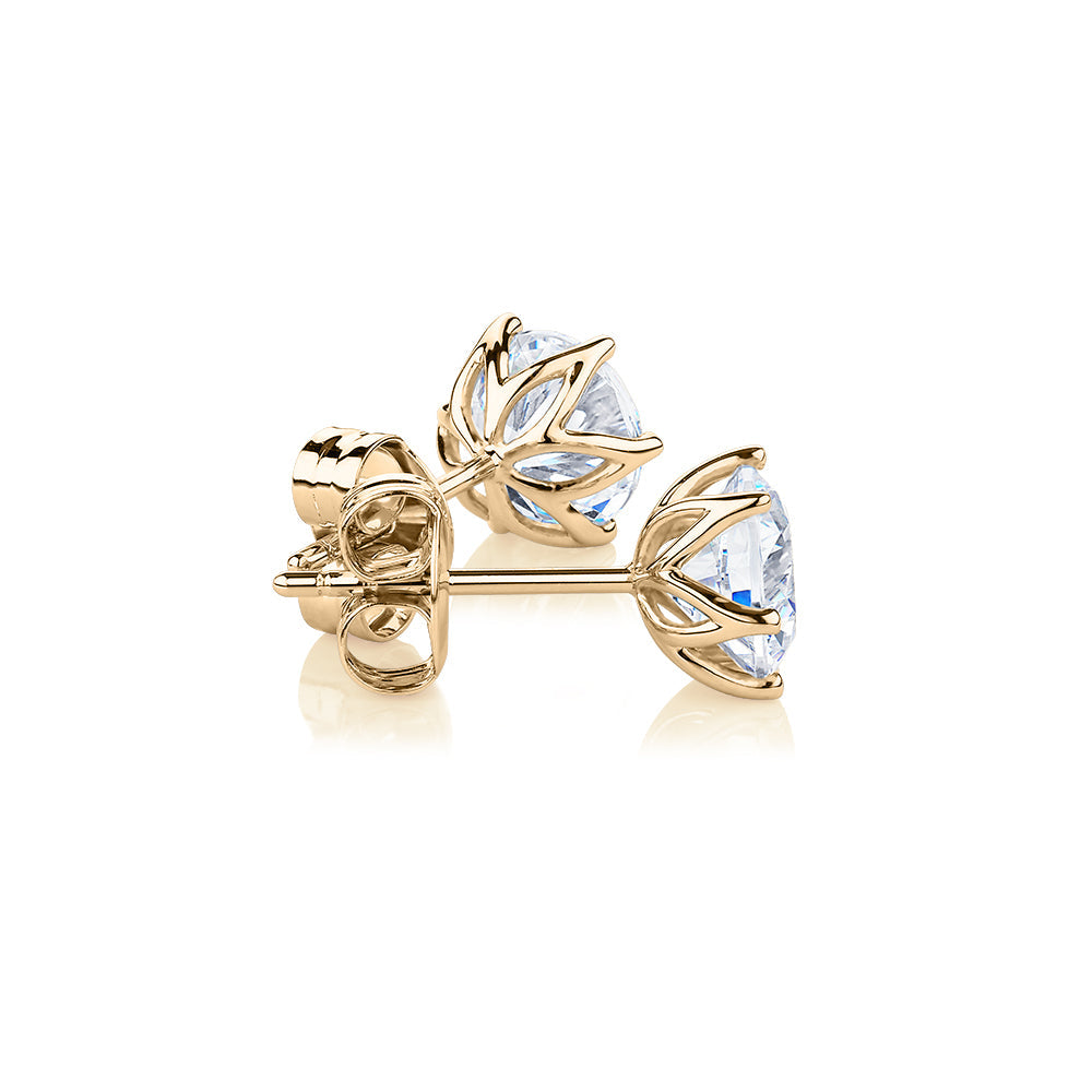 Round Brilliant stud earrings with 2 carats* of diamond simulants in 10 carat yellow gold