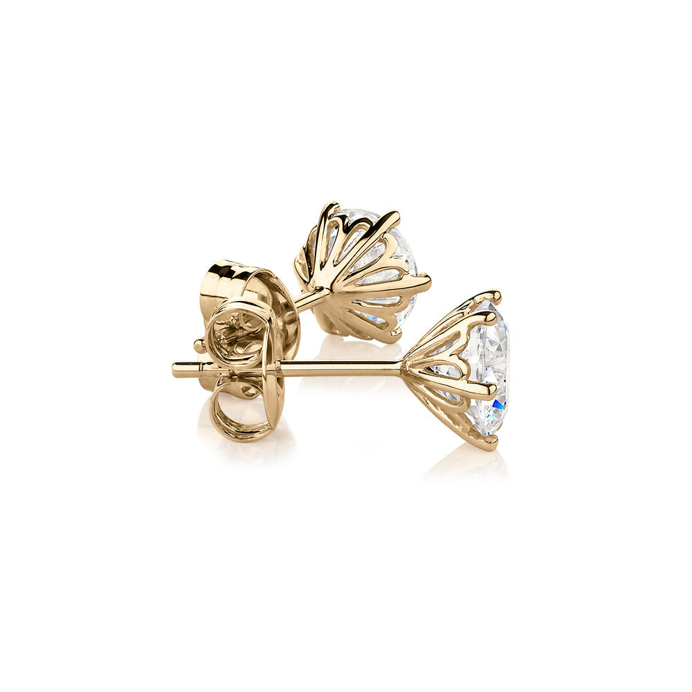 Round Brilliant stud earrings with 2 carats* of diamond simulants in 10 carat yellow gold
