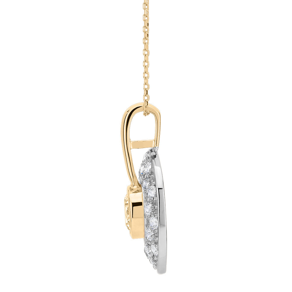 Halo pendant with 1.75 carats* of diamond simulants in 10 carat yellow gold and sterling silver