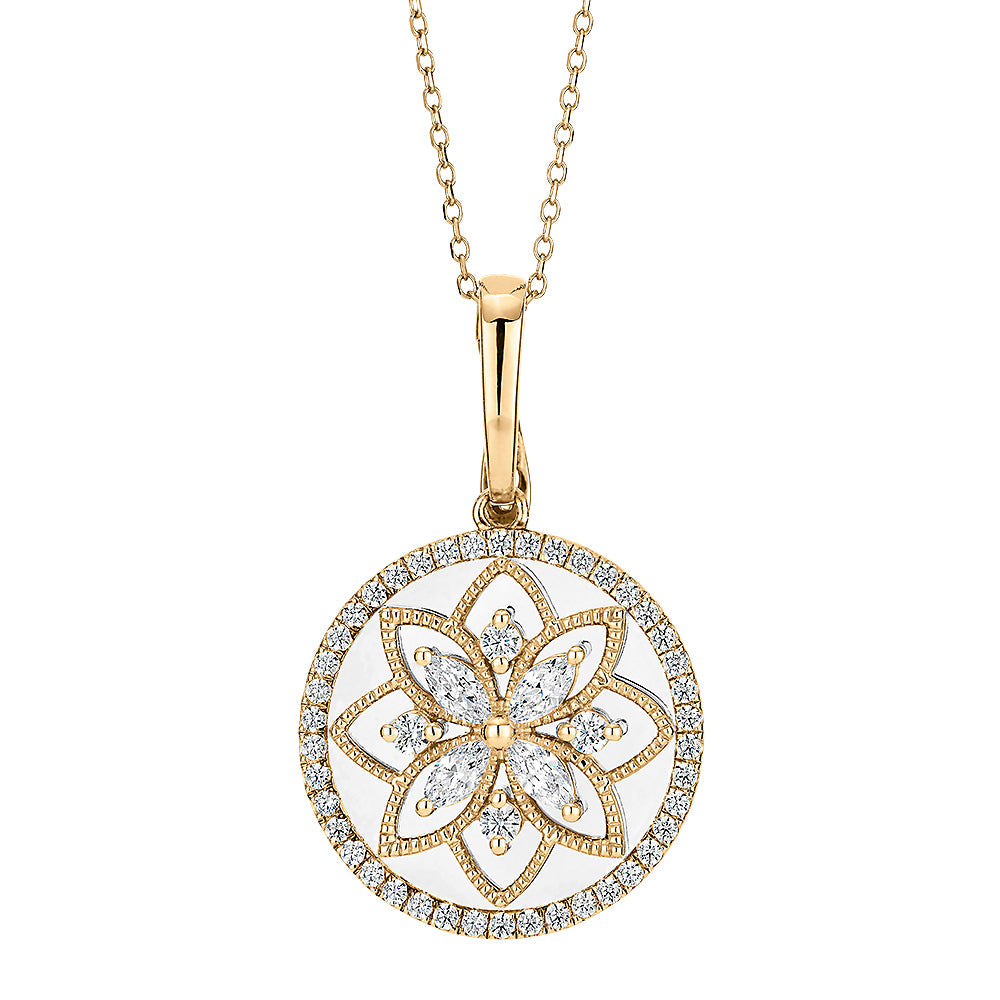 Fancy pendant with 0.64 carats* of diamond simulants in 10 carat yellow gold and sterling silver