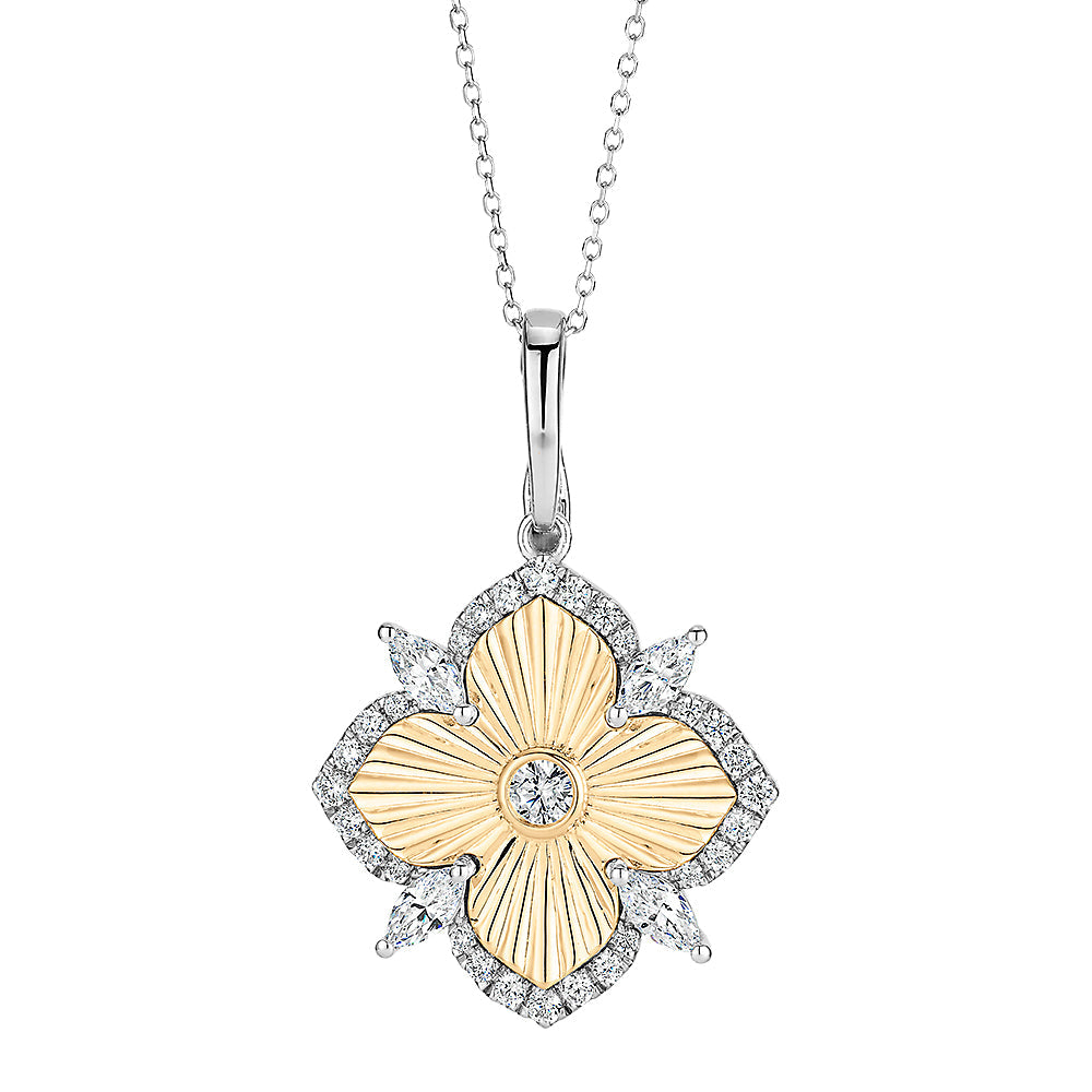 Fancy pendant with 0.97 carats* of diamond simulants in 10 carat yellow gold and sterling silver