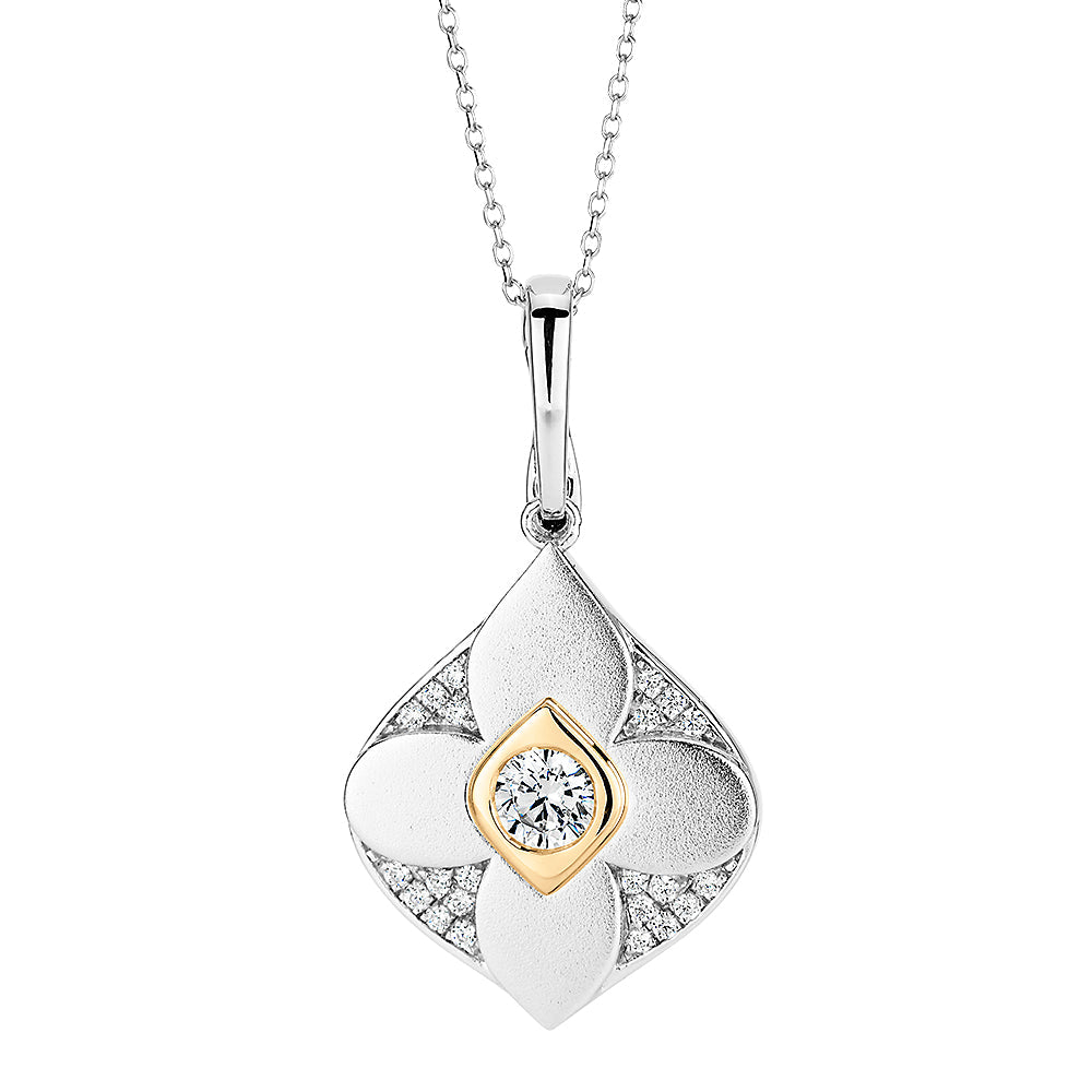 Fancy pendant with 0.47 carats* of diamond simulants in 10 carat yellow gold and sterling silver