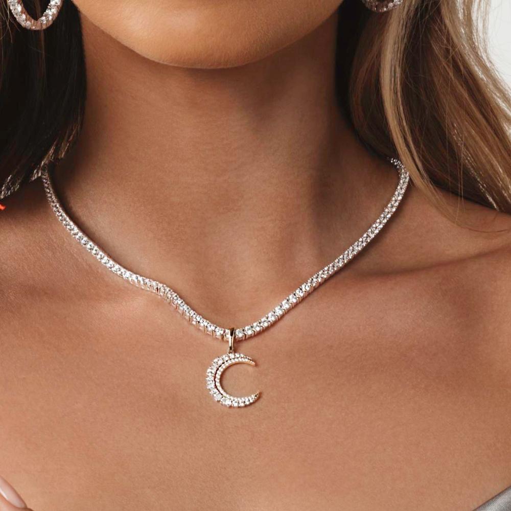 Fancy pendant with 1.12 carats* of diamond simulants in 10 carat yellow gold and sterling silver