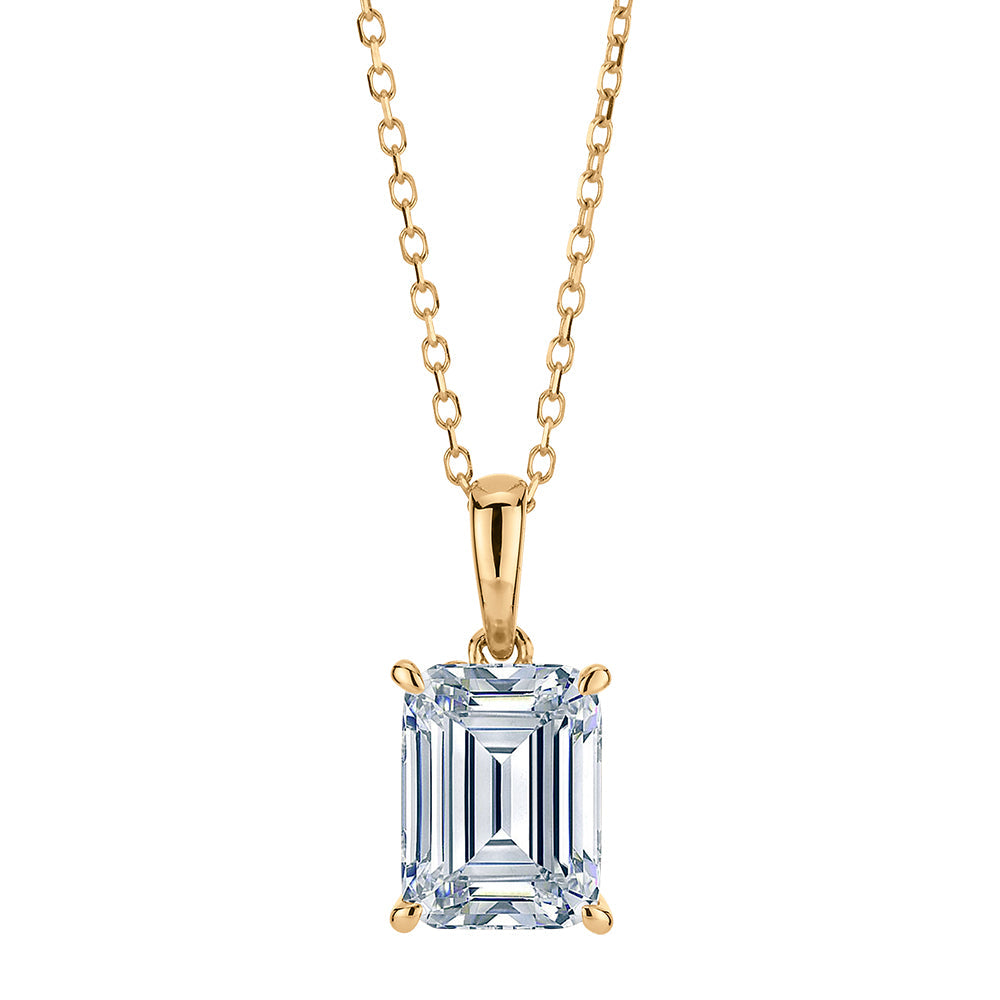 Emerald Cut and Round Brilliant solitaire pendant with 1.81 carats* of diamond simulants in 10 carat yellow gold