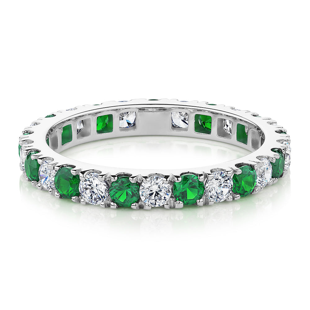 All-rounder eternity band with emerald simulants and 0.78 carats* of diamond simulants in 14 carat white gold