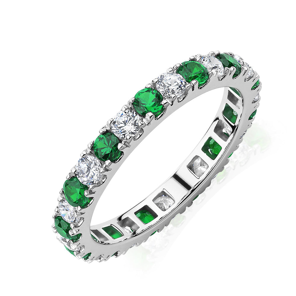 All-rounder eternity band with emerald simulants and 0.78 carats* of diamond simulants in 14 carat white gold
