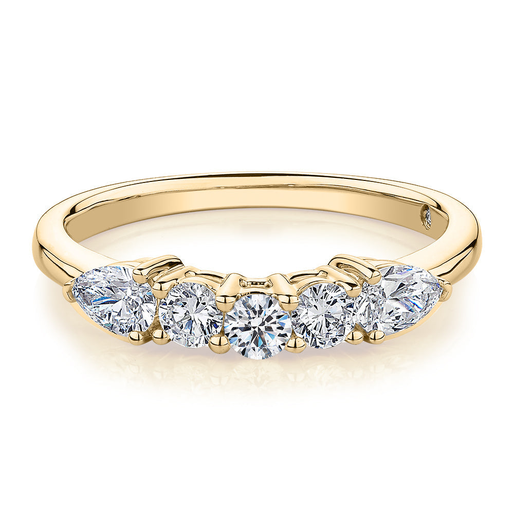 Curved wedding or eternity band with 0.83 carats* of diamond simulants in 14 carat yellow gold