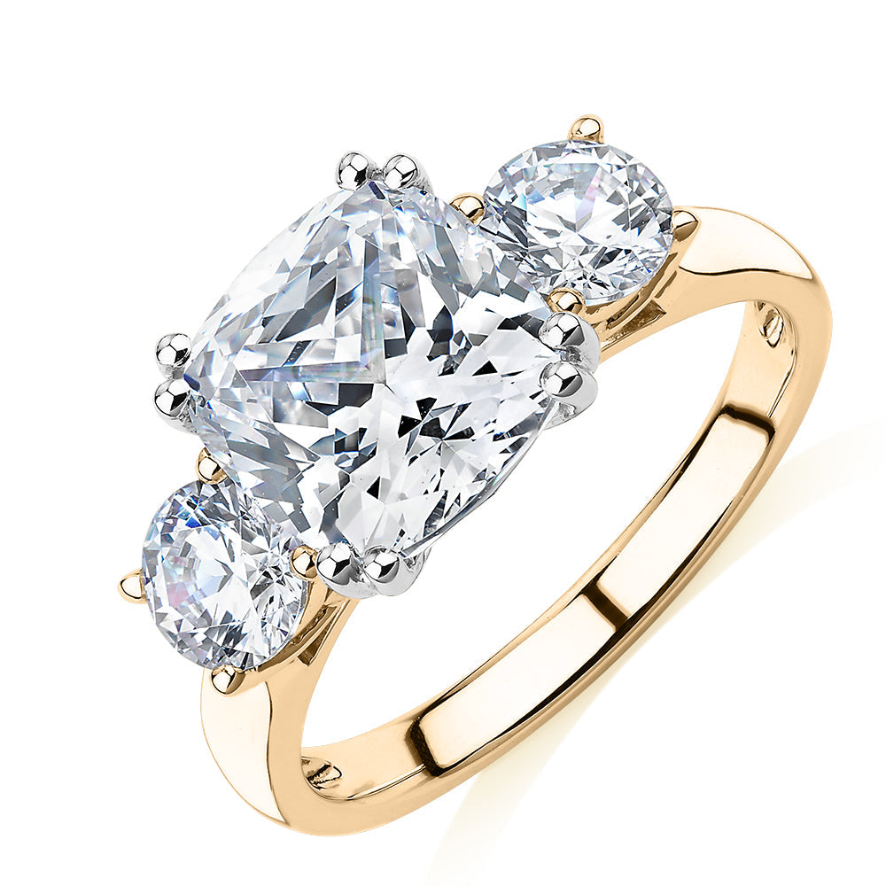 Three stone ring with 3.75 carats* of diamond simulants in 10 carat yellow and white gold