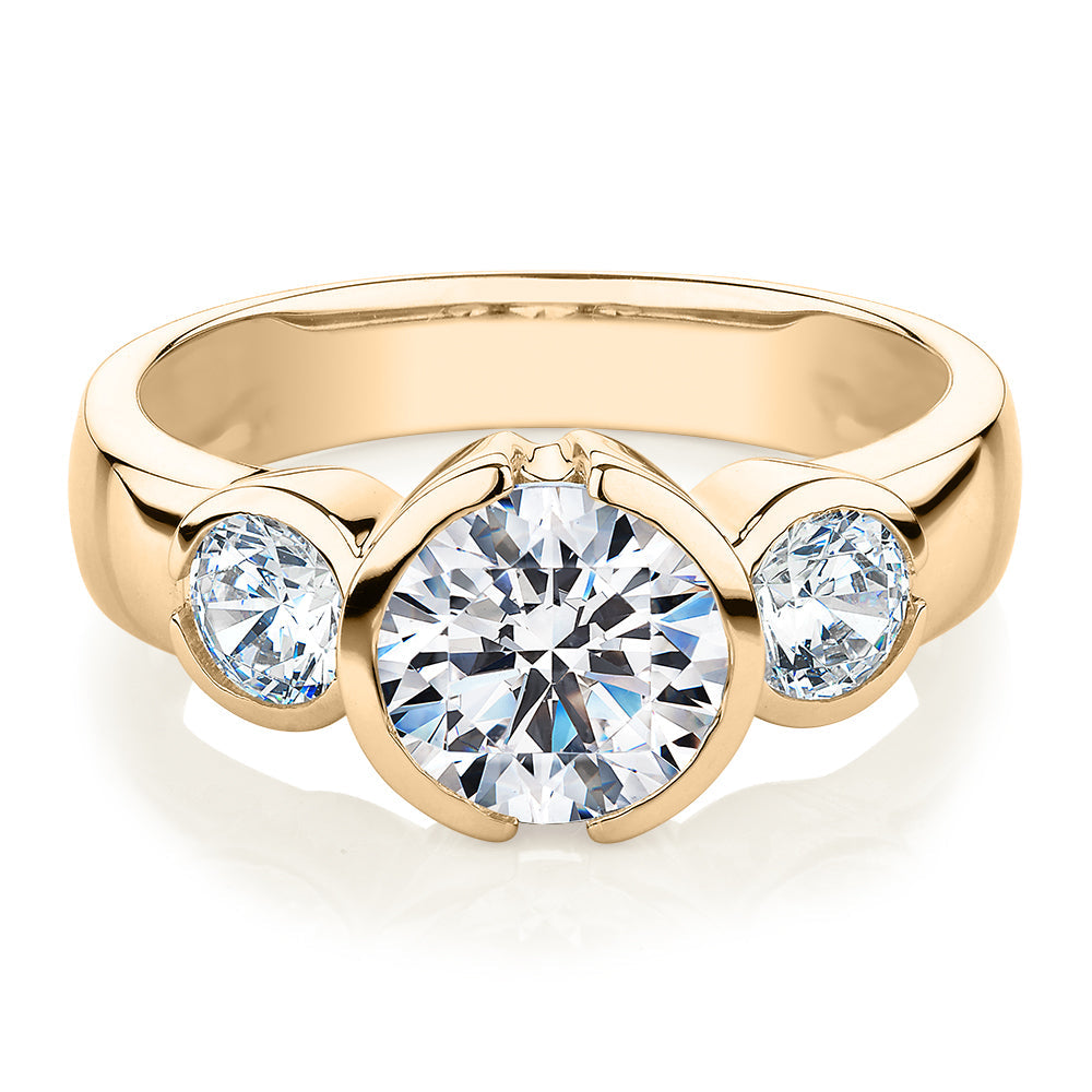 Three stone ring with 2.23 carats* of diamond simulants in 10 carat yellow gold