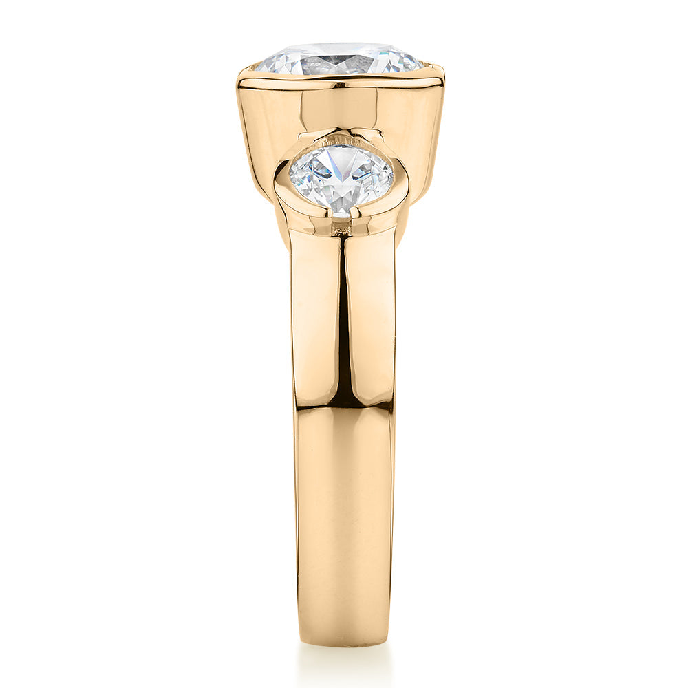 Three stone ring with 2.23 carats* of diamond simulants in 10 carat yellow gold