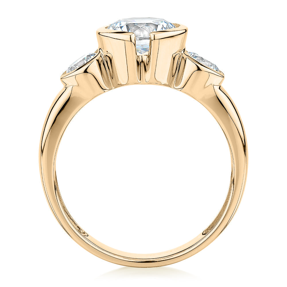 Three stone ring with 2.23 carats* of diamond simulants in 10 carat yellow gold