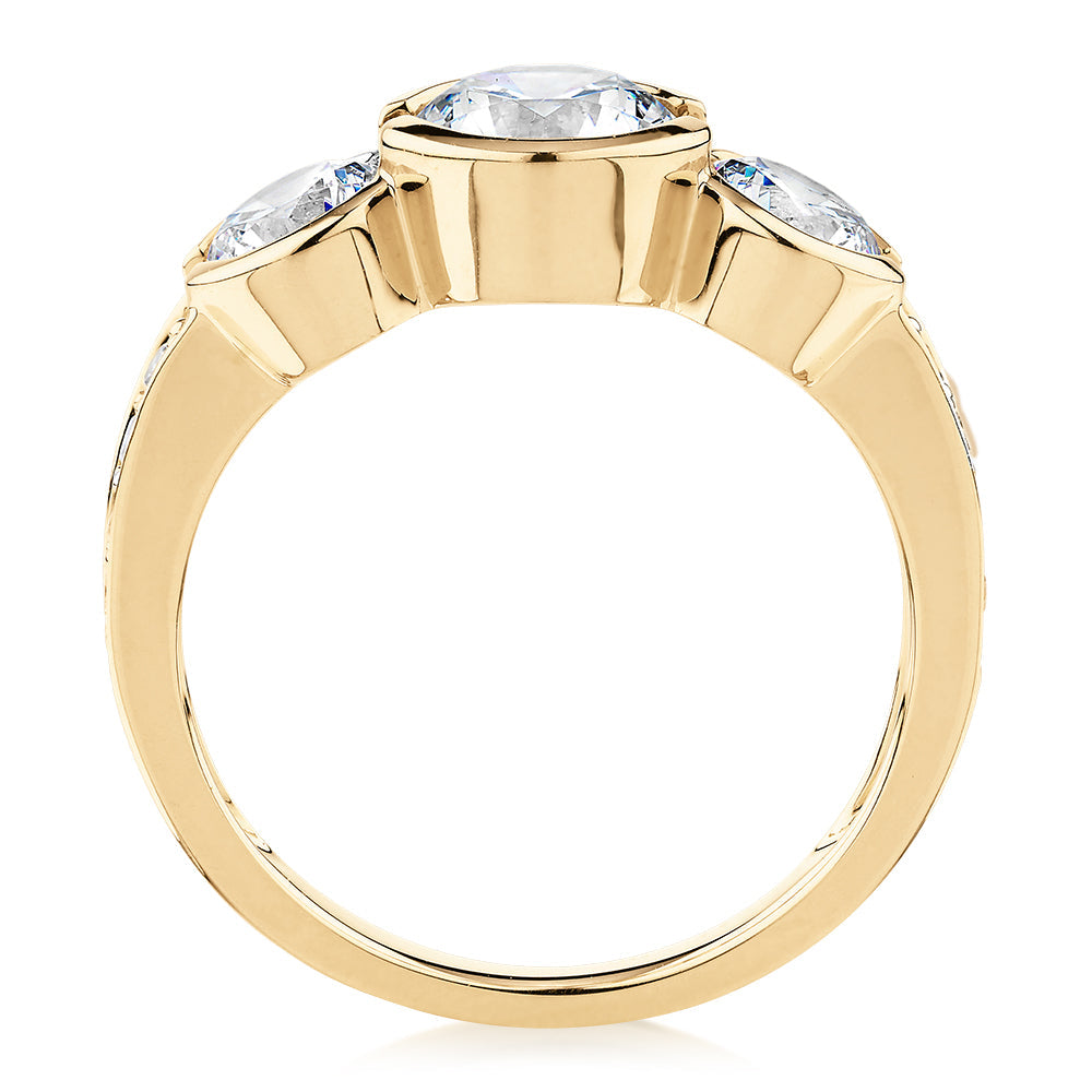 Three stone ring with 2.11 carats* of diamond simulants in 10 carat yellow gold