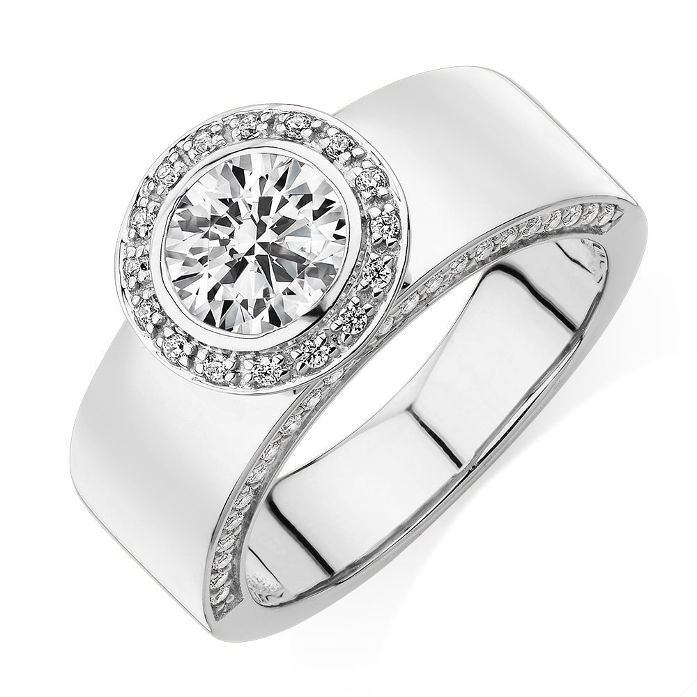 Round Brilliant halo engagement ring with 1.34 carats* of diamond simulants in 10 carat white gold