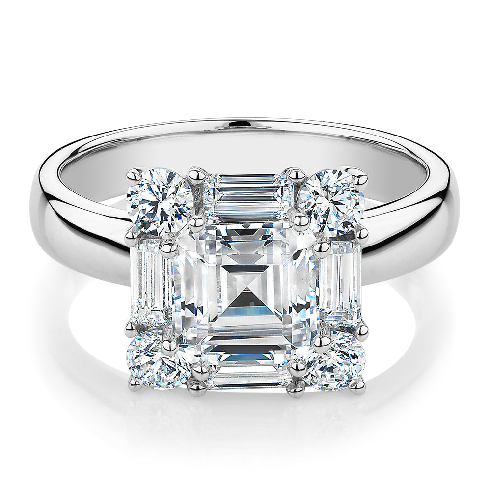 Princess Cut, Baguette and Round Brilliant halo engagement ring with 2.59 carats* of diamond simulants in 10 carat white gold