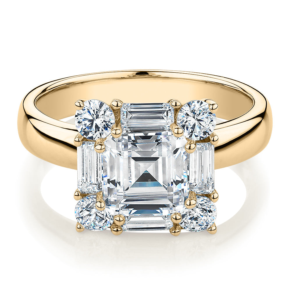 Princess Cut, Baguette and Round Brilliant halo engagement ring with 2.59 carats* of diamond simulants in 10 carat yellow gold