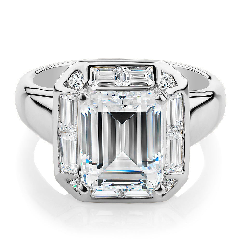 Emerald Cut, Baguette and Round Brilliant halo engagement ring with 4.53 carats* of diamond simulant