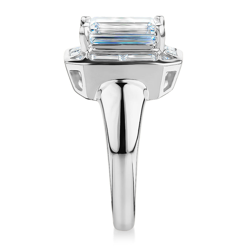 Emerald Cut, Baguette and Round Brilliant halo engagement ring with 4.53 carats* of diamond simulant