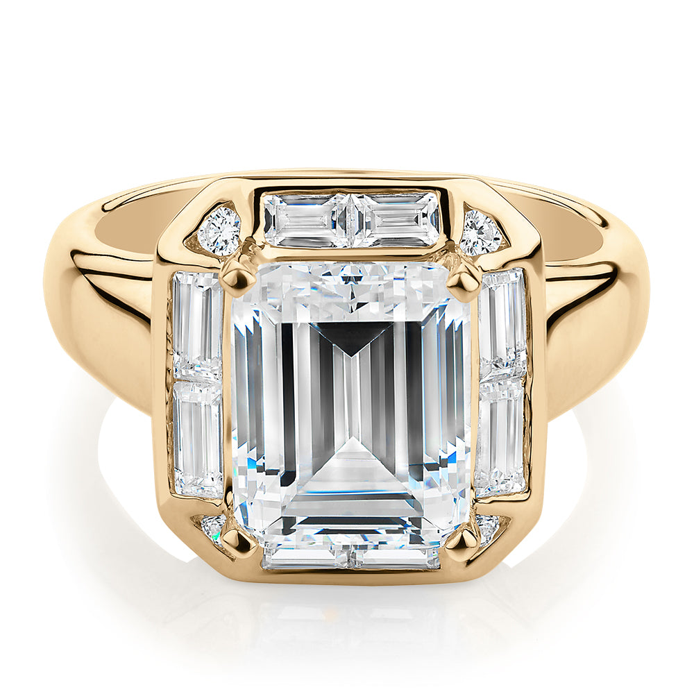 Emerald Cut, Baguette and Round Brilliant halo engagement ring with 4.53 carats* of diamond simulants in 10 carat yellow gold