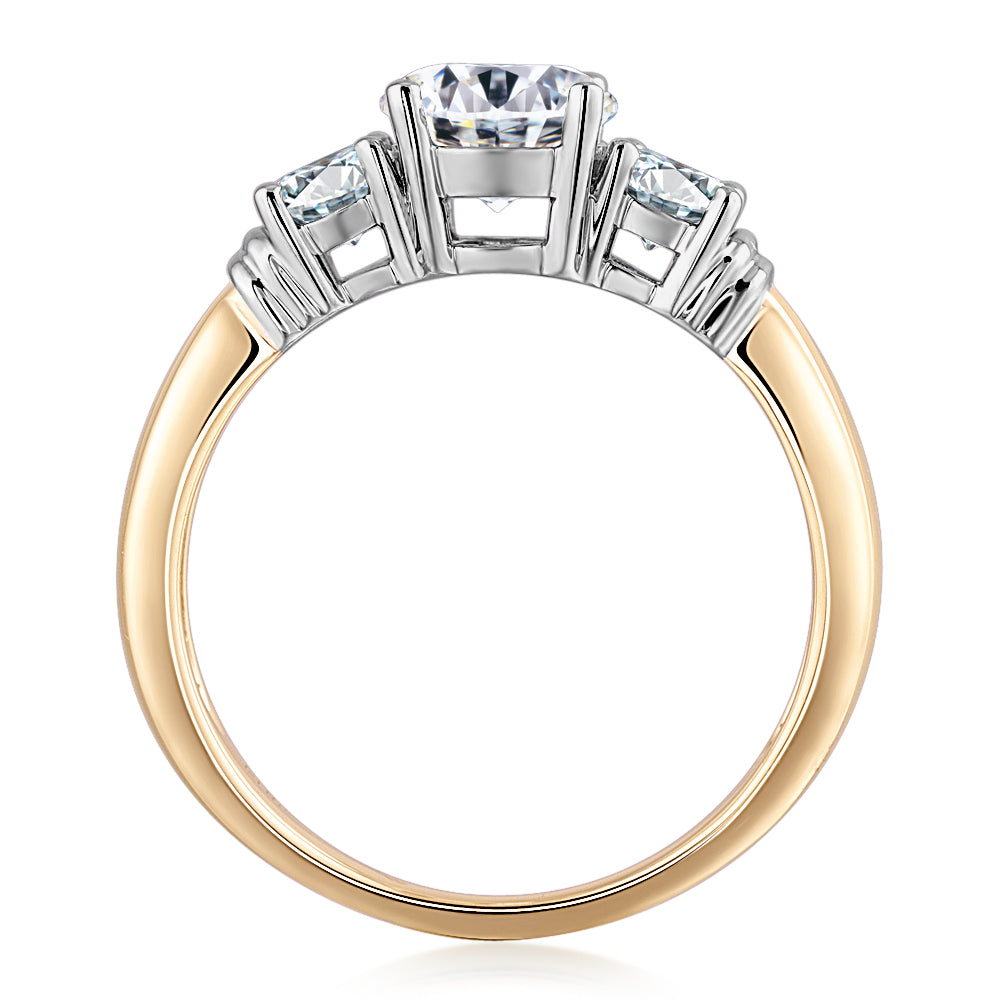 Three stone ring with 1.53 carats* of diamond simulants in 14 carat yellow and white gold