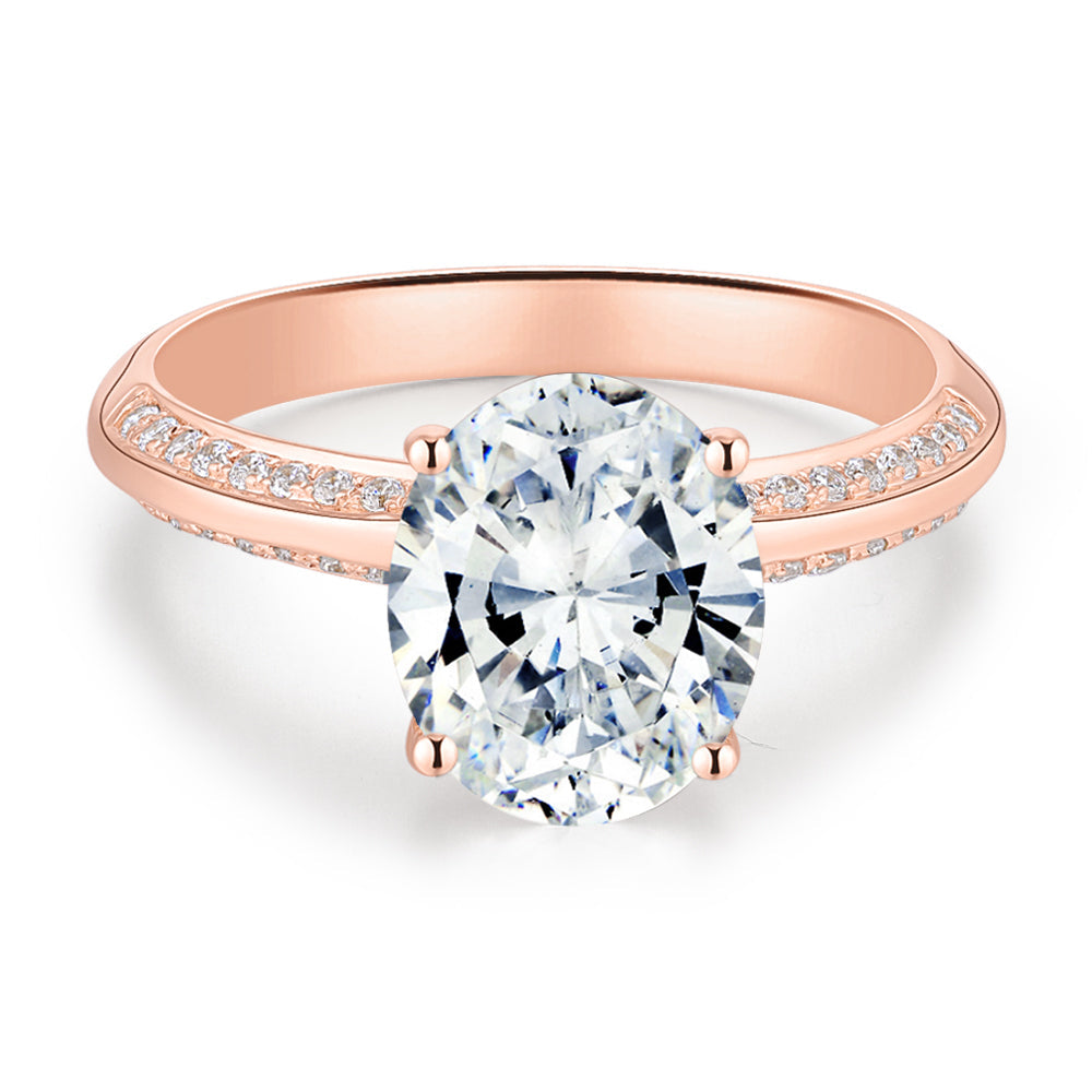 Oval and Round Brilliant shouldered engagement ring with 2.74 carats* of diamond simulants in 14 carat rose gold