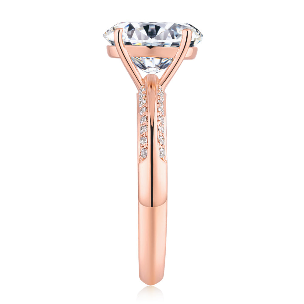 Oval and Round Brilliant shouldered engagement ring with 2.74 carats* of diamond simulants in 14 carat rose gold