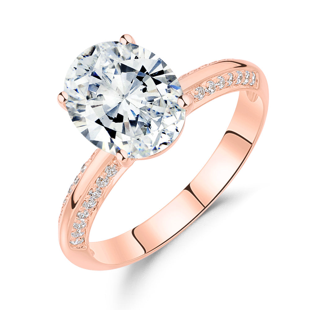 Oval and Round Brilliant shouldered engagement ring with 2.74 carats* of diamond simulants in 14 carat rose gold