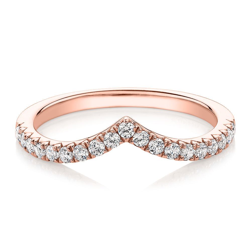 Round Brilliant curved wedding or eternity band with 0.57 carats* of diamond simulants in 10 carat rose gold
