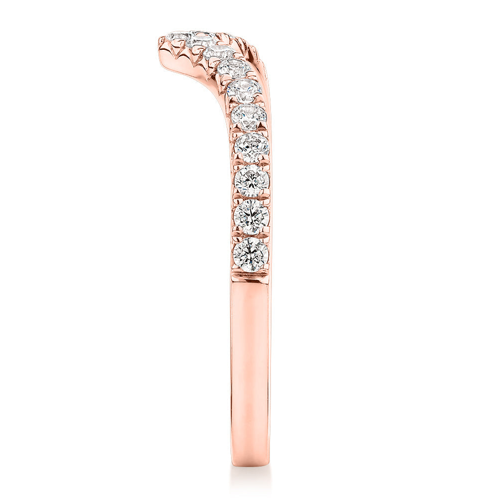 Round Brilliant curved wedding or eternity band with 0.57 carats* of diamond simulants in 10 carat rose gold