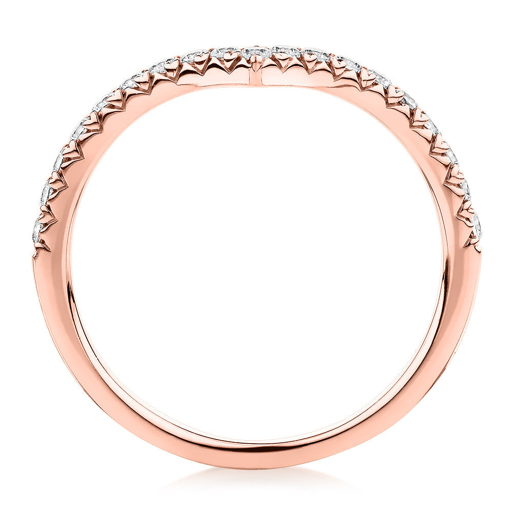 Round Brilliant curved wedding or eternity band with 0.57 carats* of diamond simulants in 10 carat rose gold