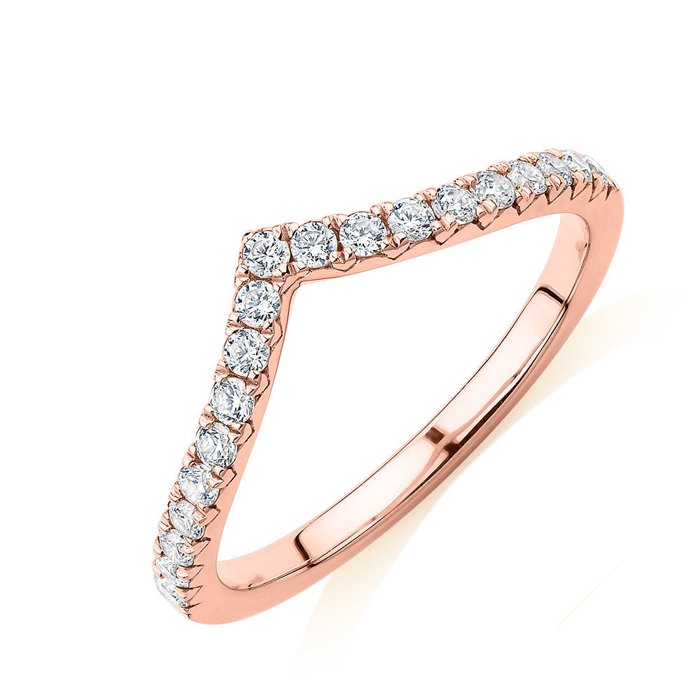 Round Brilliant curved wedding or eternity band with 0.57 carats* of diamond simulants in 10 carat rose gold