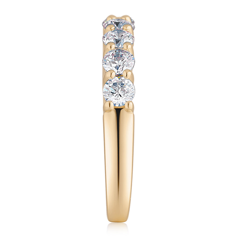 Wedding or eternity band with 0.84 carats* of diamond simulants in 14 carat yellow gold