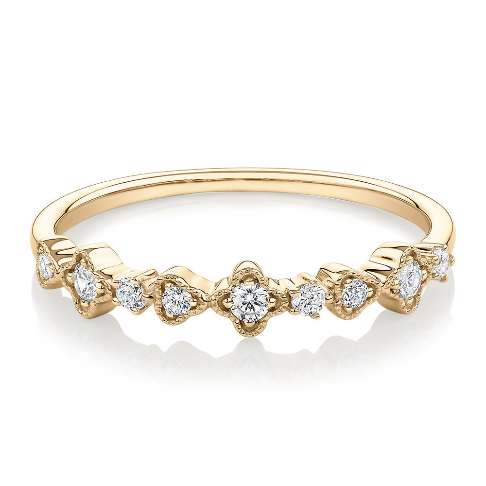 Wedding or eternity band with diamond simulants in 10 carat yellow gold
