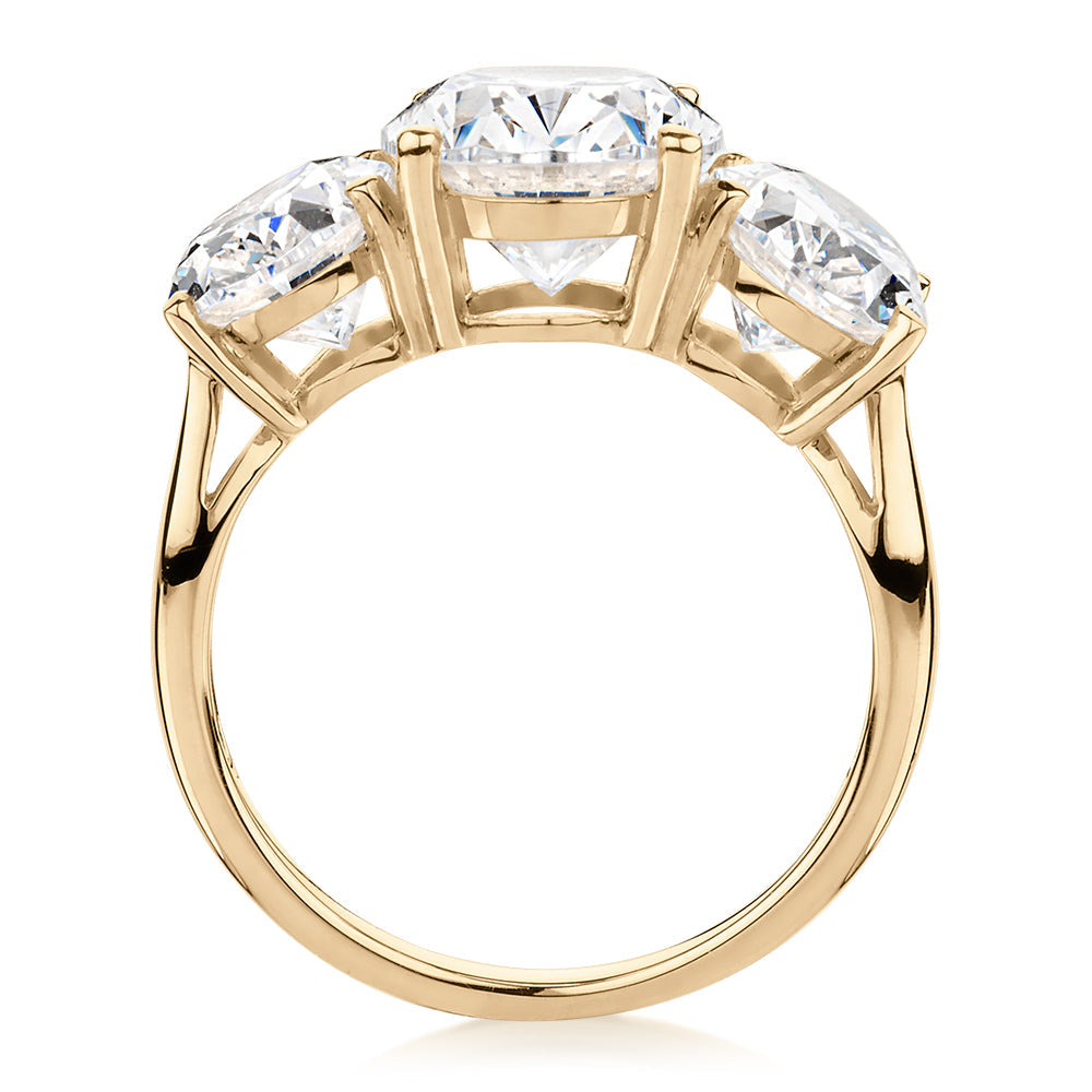 Three stone ring with 7.57 carats* of diamond simulants in 10 carat yellow gold