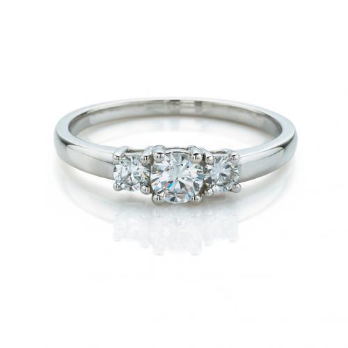 Three stone ring with round brilliant cut diamond simulants in 10 carat white gold