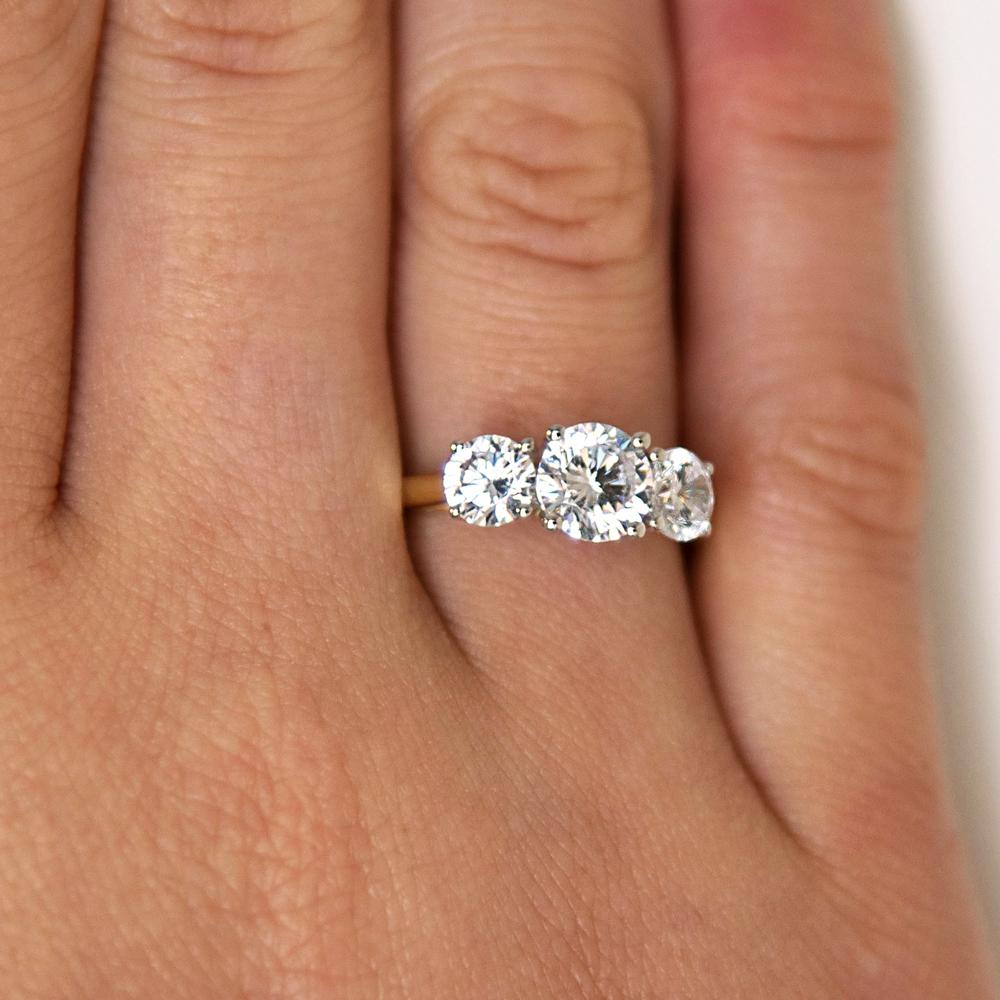 Signature Simulant Diamond 2.00 carat* TW round brilliant cut three stone engagement ring in 10 carat yellow and white gold