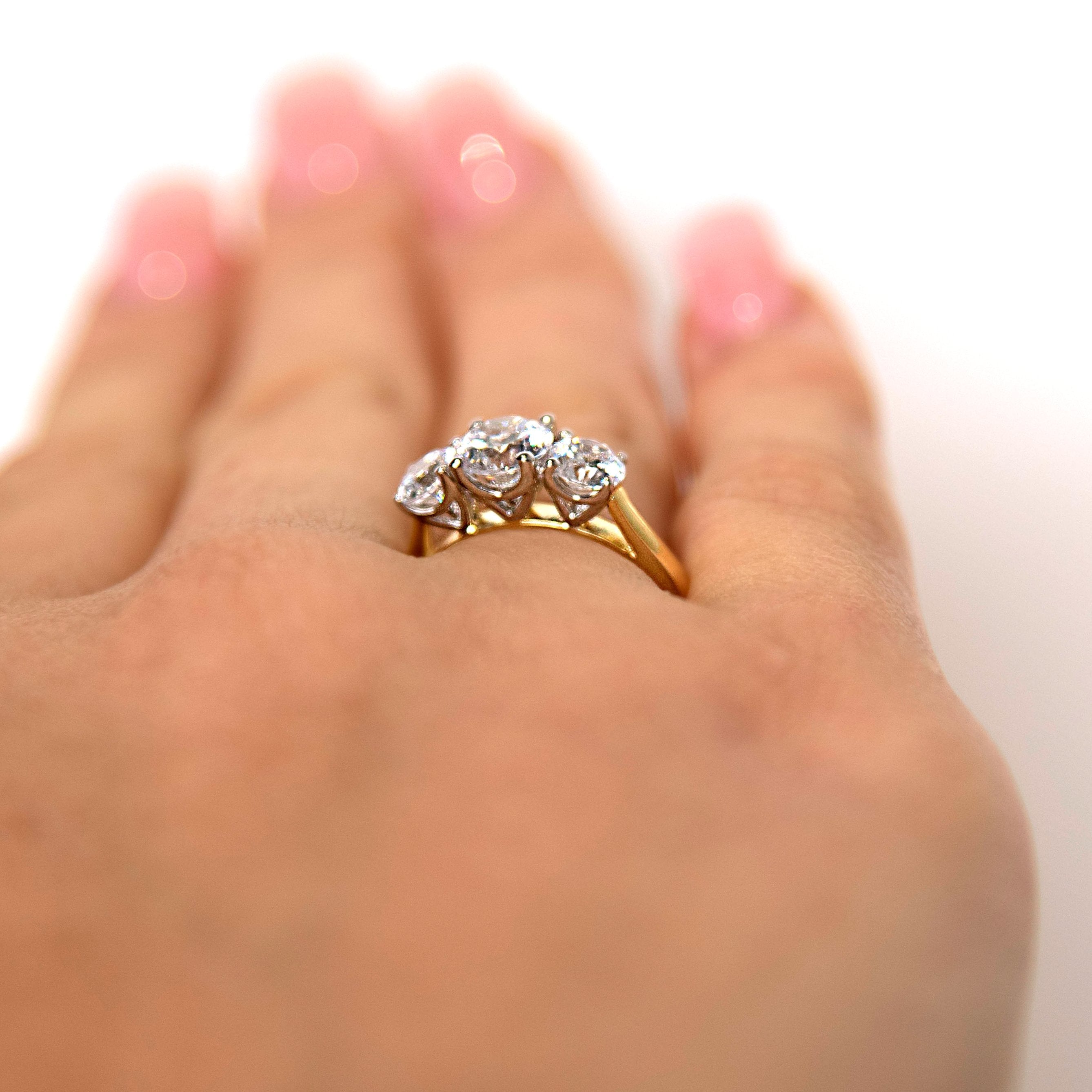 Signature Simulant Diamond 2.00 carat* TW round brilliant cut three stone engagement ring in 10 carat yellow and white gold