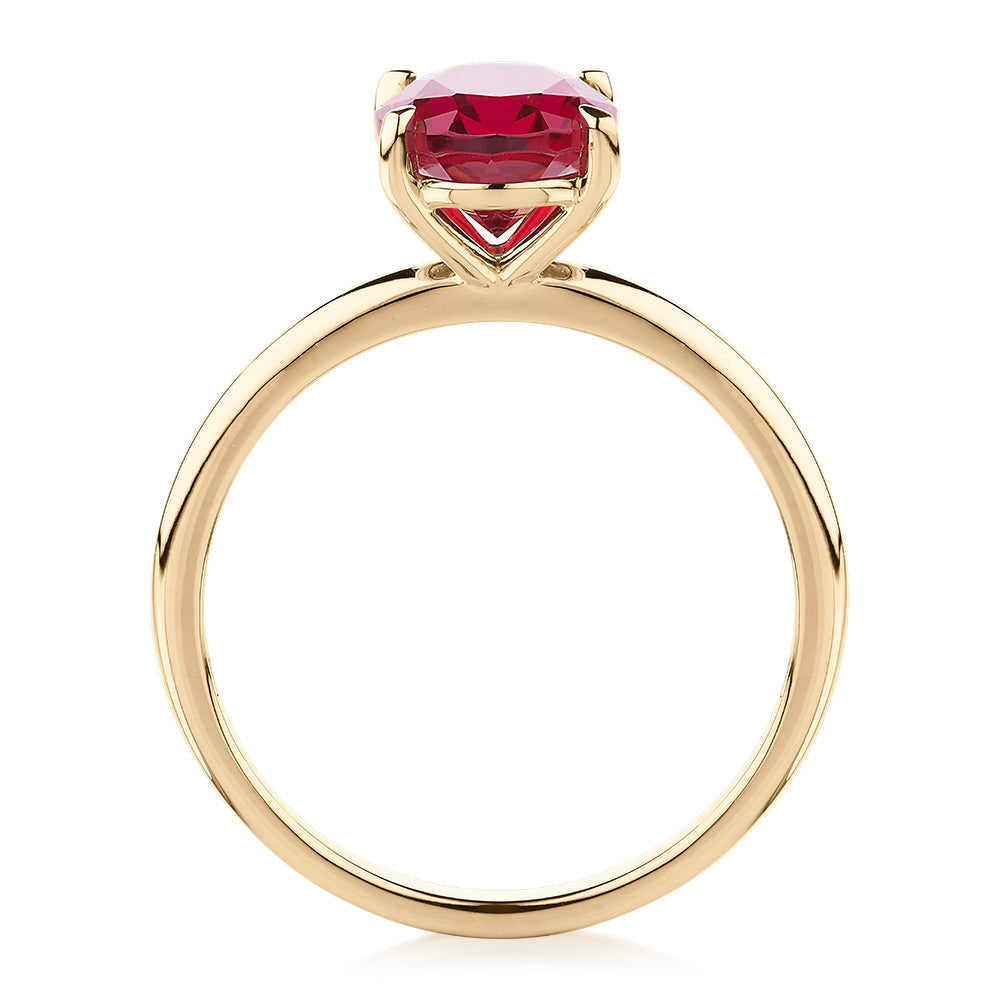 Dress ring with ruby simulant in 10 carat yellow gold