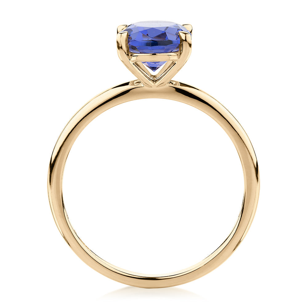 Dress ring with tanzanite simulant in 10 carat yellow gold