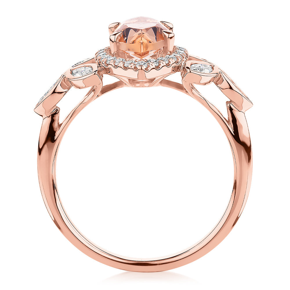 Marquise and Round Brilliant halo engagement ring with morganite simulant and 0.84 carats* of diamond simulants in 10 carat rose gold