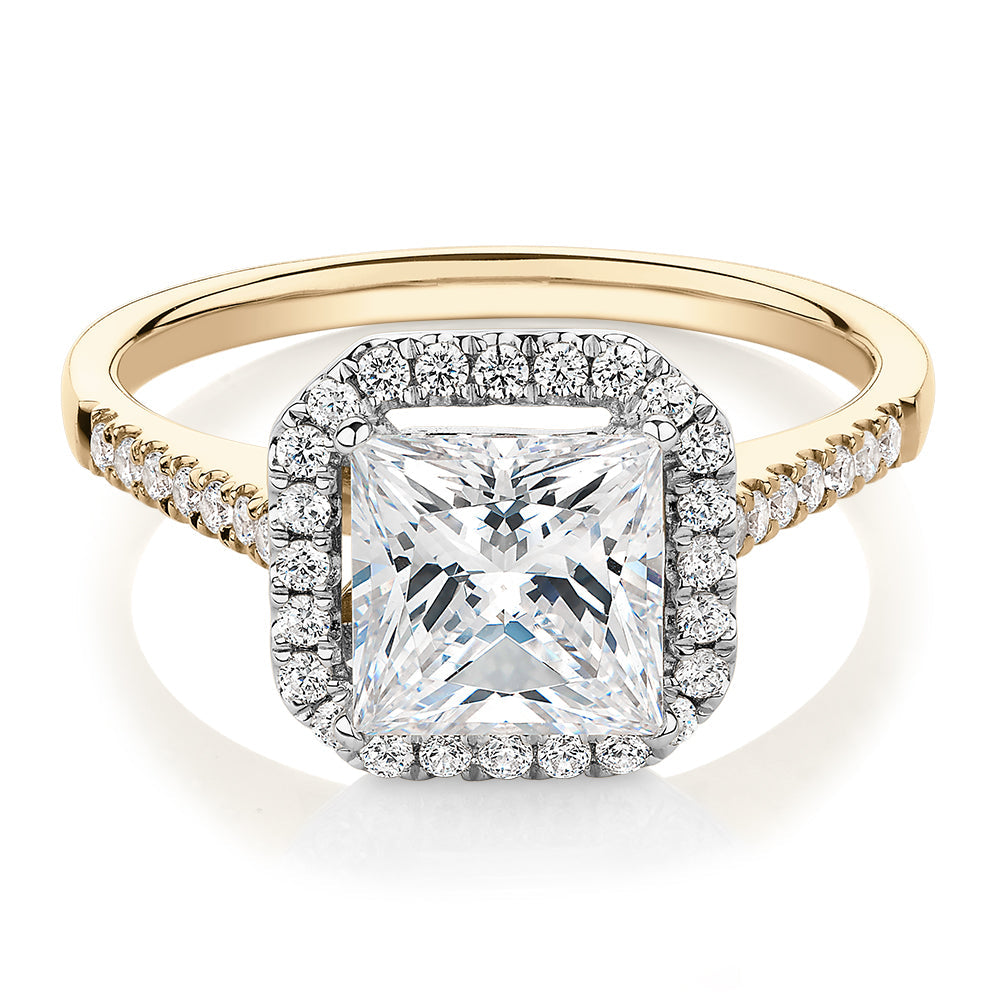 Princess Cut and Round Brilliant halo engagement ring with 2.21 carats* of diamond simulants in 14 carat yellow and white gold