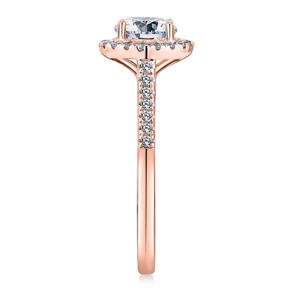 Round Brilliant halo engagement ring with 1.25 carats* of diamond simulants in 14 carat rose gold
