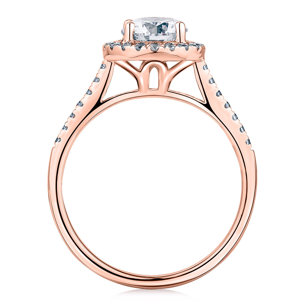 Round Brilliant halo engagement ring with 1.25 carats* of diamond simulants in 14 carat rose gold